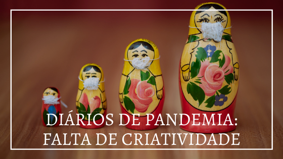 Foto de matrioscas com máscaras brancas. Em frente a foto, escrito "diários de pandemia: falta de criatividade".